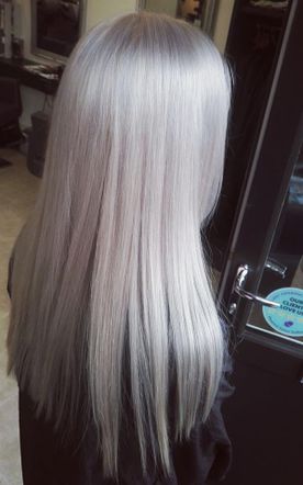 A woman's hair that has been dyed silver by our team