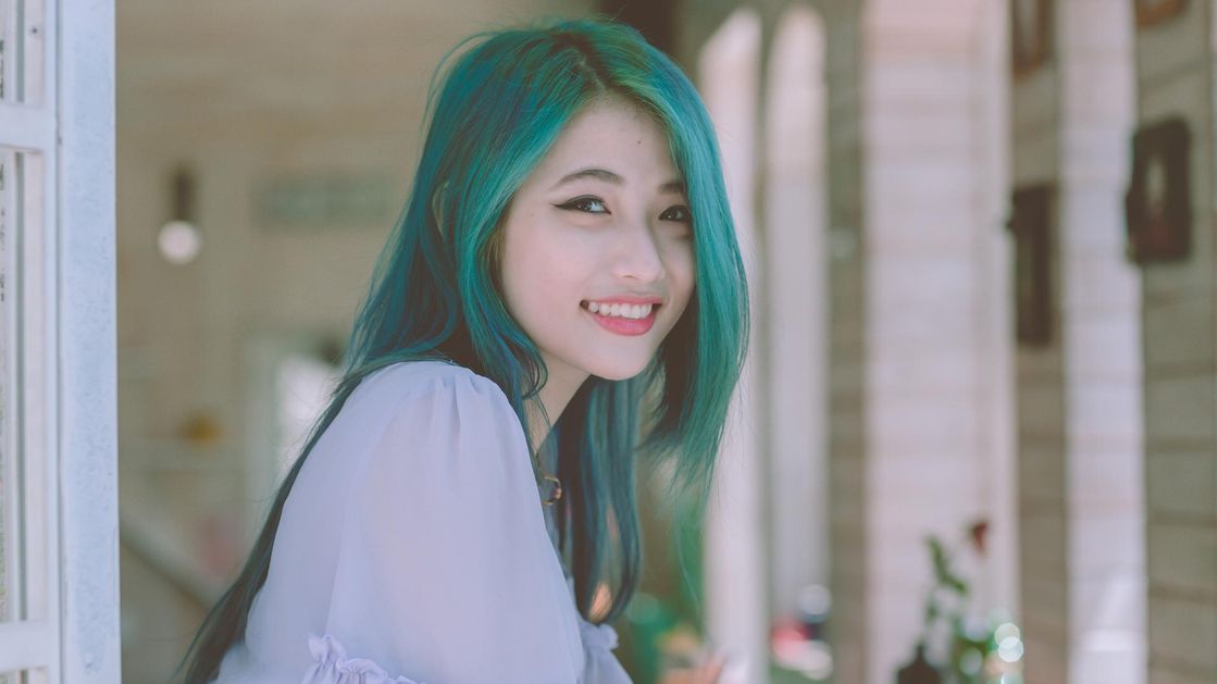 A woman with green dyed hair