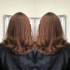 A woman that has got her hair cut shorter by our professionals 